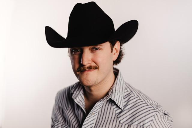 a crowd of people have their phones in their hands with the flashlight on and sing