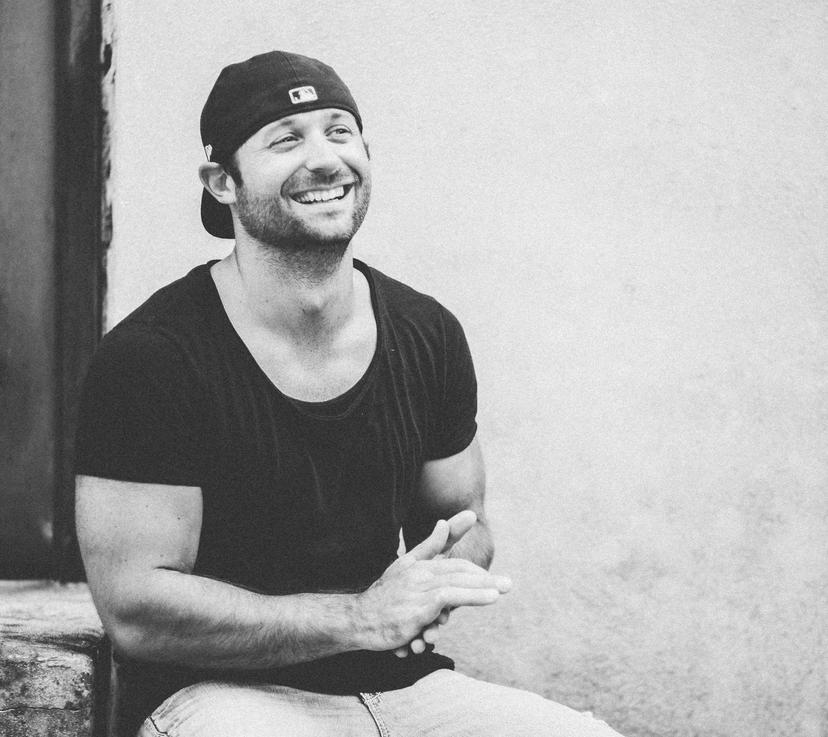 a crowd of people have their phones in their hands with the flashlight on and sing