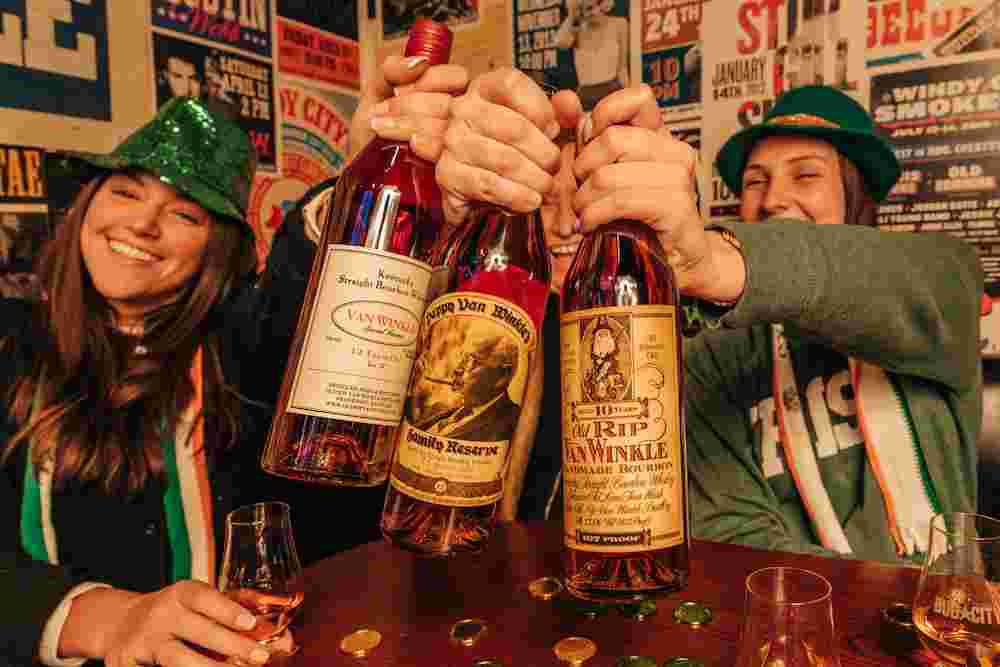 three bottles of pappy van winkle whiskey bottles on the bar at bub city