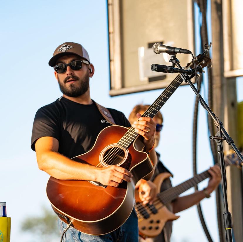 a crowd of people have their phones in their hands with the flashlight on and sing