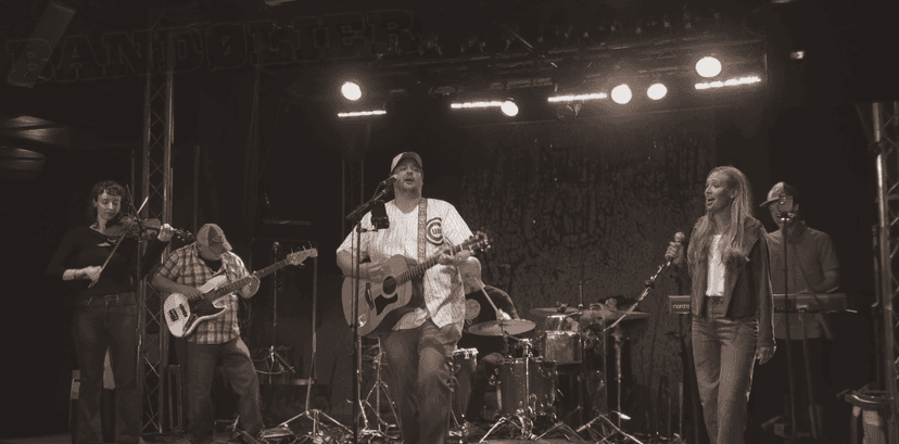 a crowd of people have their phones in their hands with the flashlight on and sing