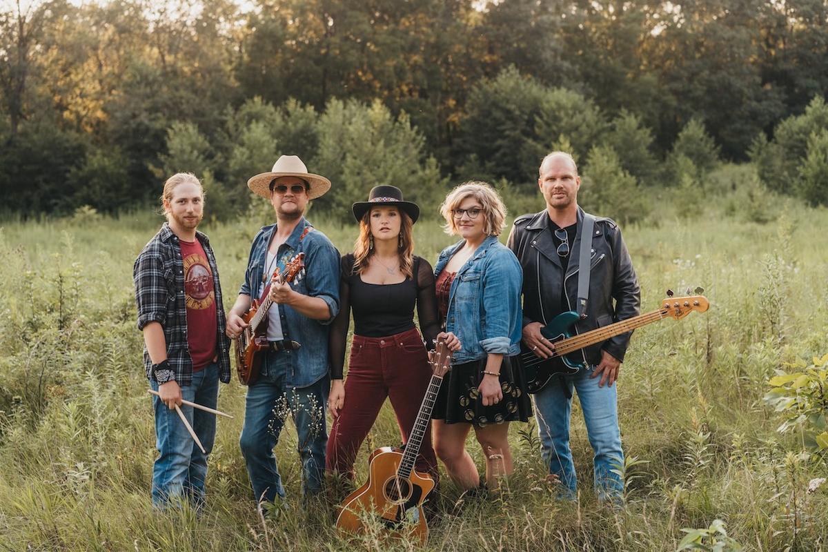a crowd of people have their phones in their hands with the flashlight on and sing